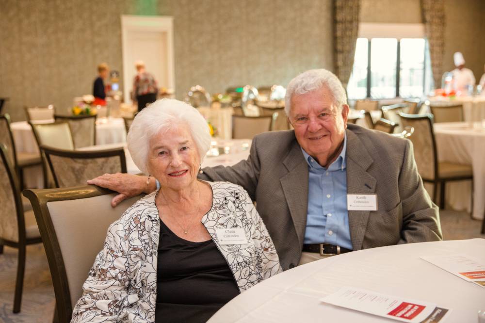 Two guests sitting at a table at Naples 2019